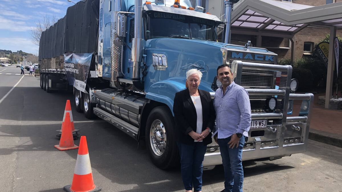 Oberon mayor Kathy Sajowitz and Sutherland mayor Carmelo Pesce welcome a load of hay, arranged through Rural Aid’s Buy a Bale program, in 2018. picture: supplied