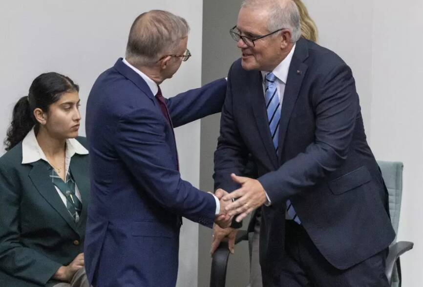 Prime Minister Anthony Albanese shakes hands with former prime minister Scott Morrison. Picture by Gary Ramag