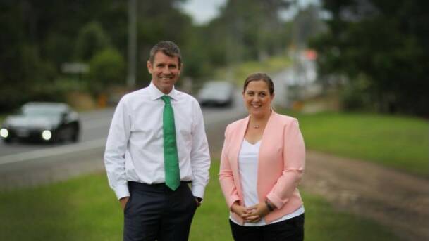 Melanie Gibbons with former Premier Mike Baird alongside Heathcote Road, which crosses both the Holsworthy and Hughes electorates. Picture: supplied