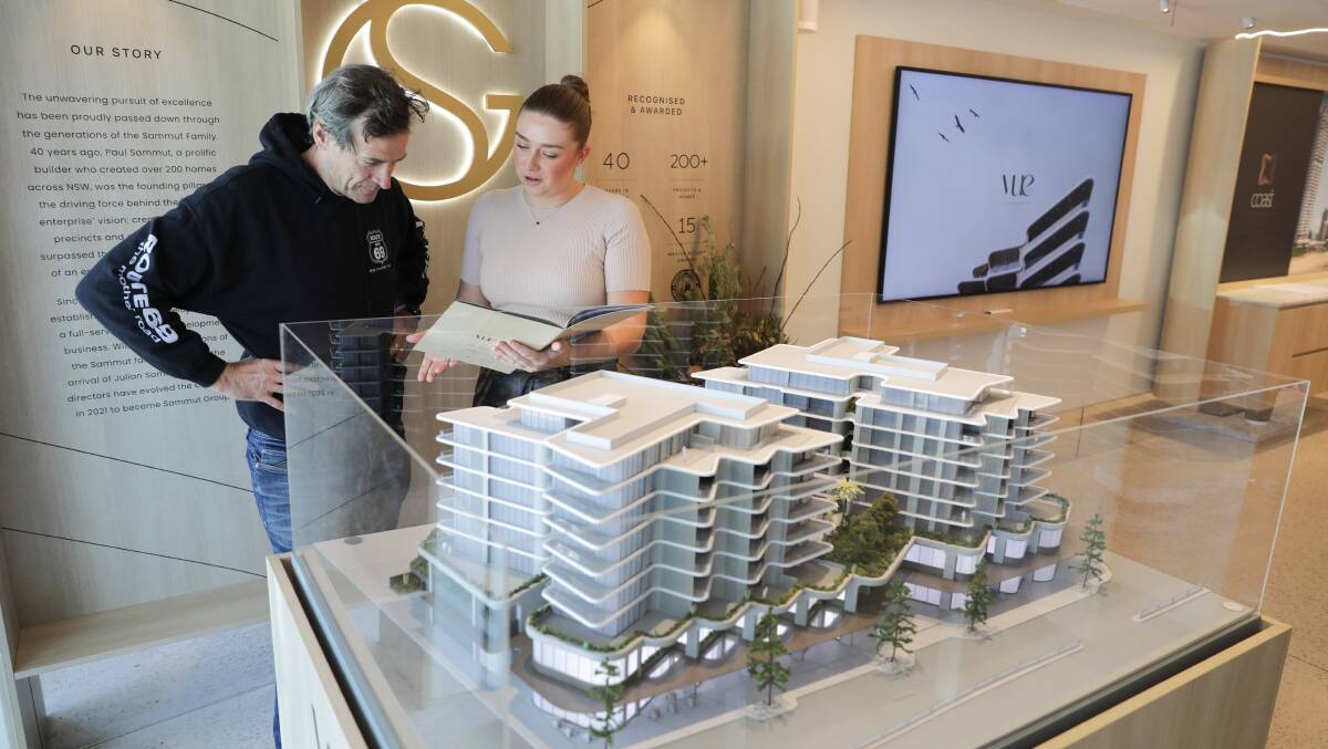 A sales consultant discusses the Vue development, which will be built on the block opposite the northern end of the mall. Picture by John Veage