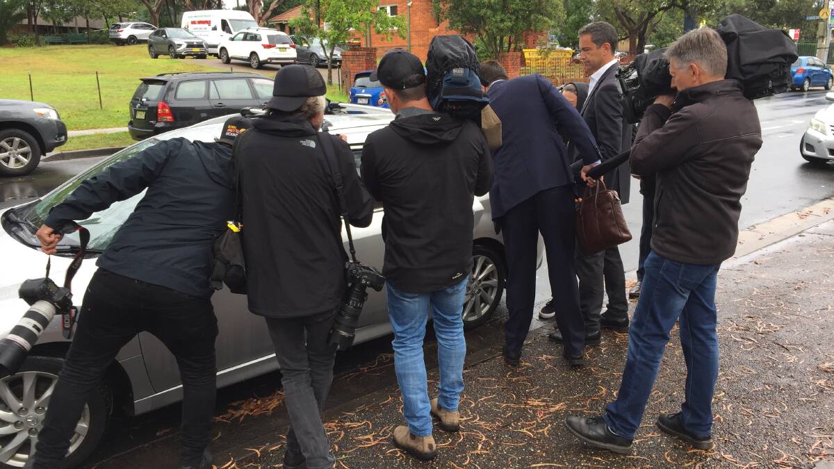 The media follow Dale Palmer as she leaves Sutherland Local Court.