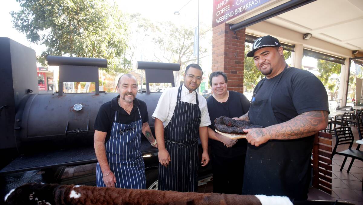 Head chef Joseph Galuvao (foreground) Rocky Pitarelli (second from right) and staff members at Lazona Bar and Grill in Gymea. Picture: Chris Lane