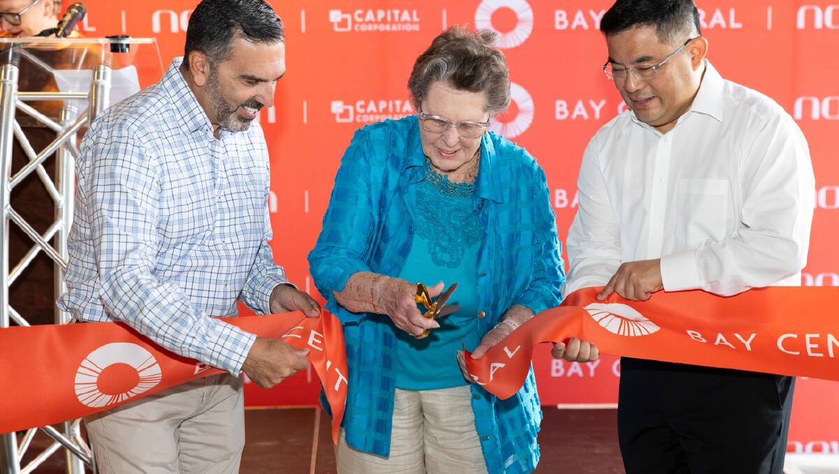 Woolooware Bay resident Elaine Garner, 91, cuts the ribbon to officially open Bay Central. Picture Facebook