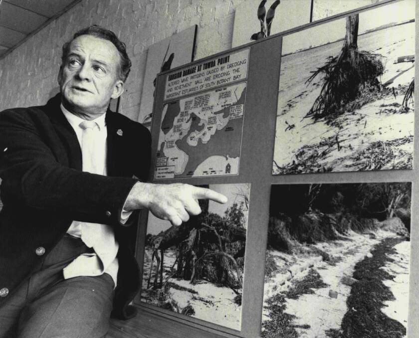 Bernie Clarke points out some of the effects of beach erosion in Botany Bay in 1975. Picture: Peter Moxham / Fairfax Media