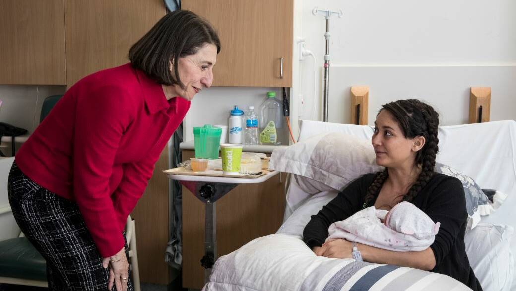 Gladys Berejiklian chats with a mother at Westmead Hospital during the announcement of the budget measures. Picture: Jessica Hromas