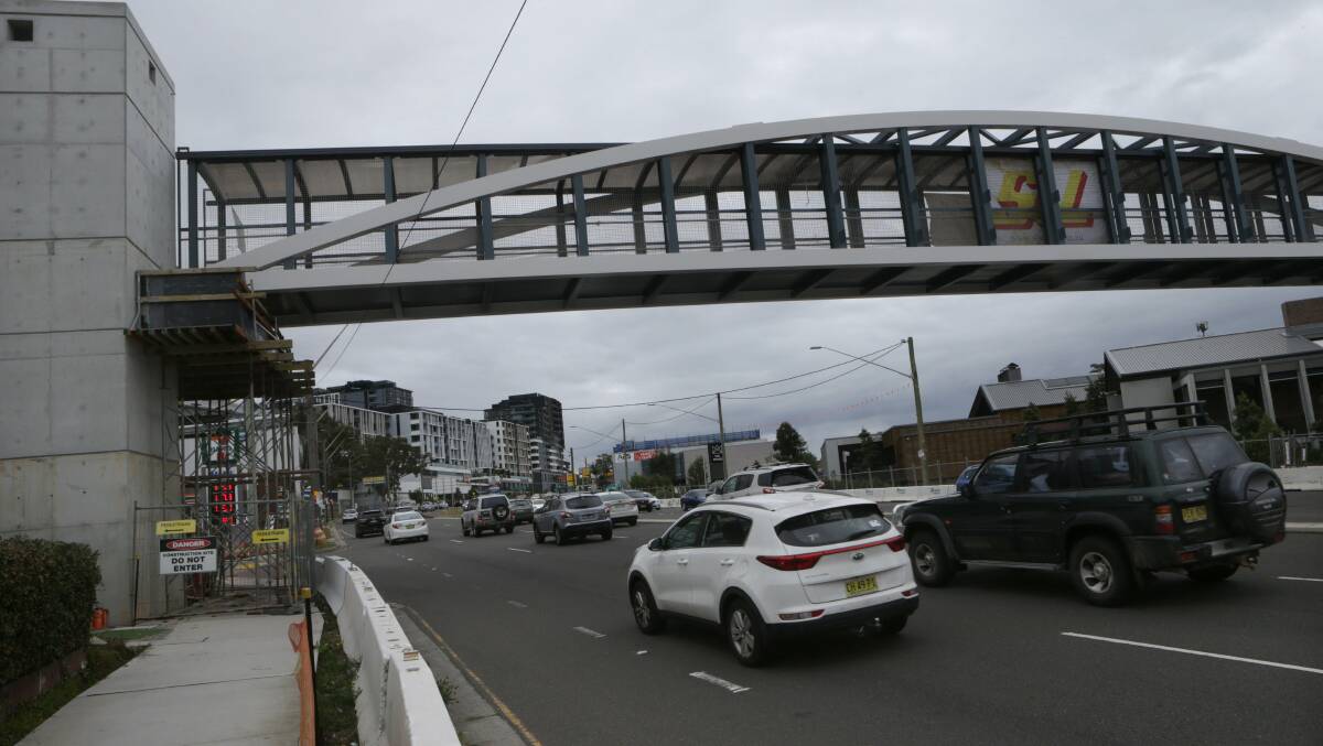 Debate over: Motorists drive beneath the new bridge at Kirrawee on Sunday. Picture: John Veage
