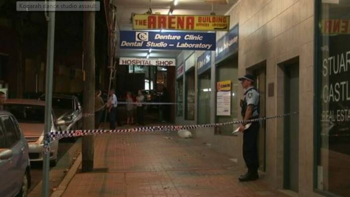 Police stand guard outside the Kogarah premises. Picture: ABC
