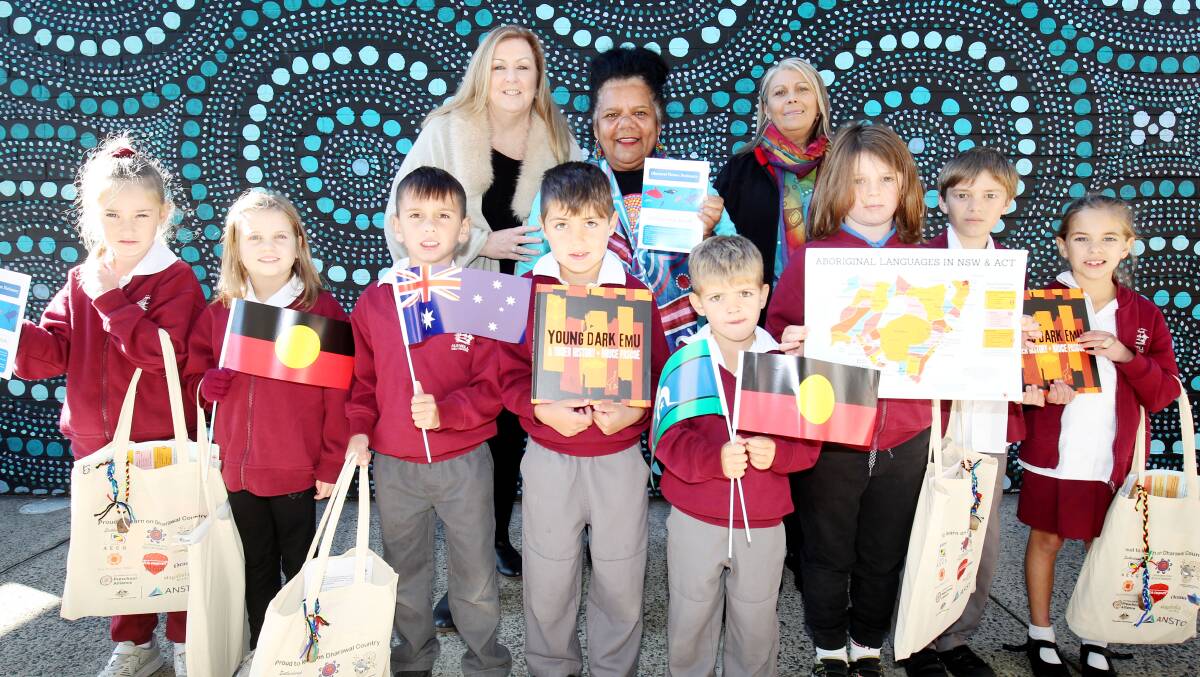 Jo Graham, Aunty Dolly Brown and Karen Armstrong with children at Kurnell Public School, who received starter packs. Picture: Chris Lane