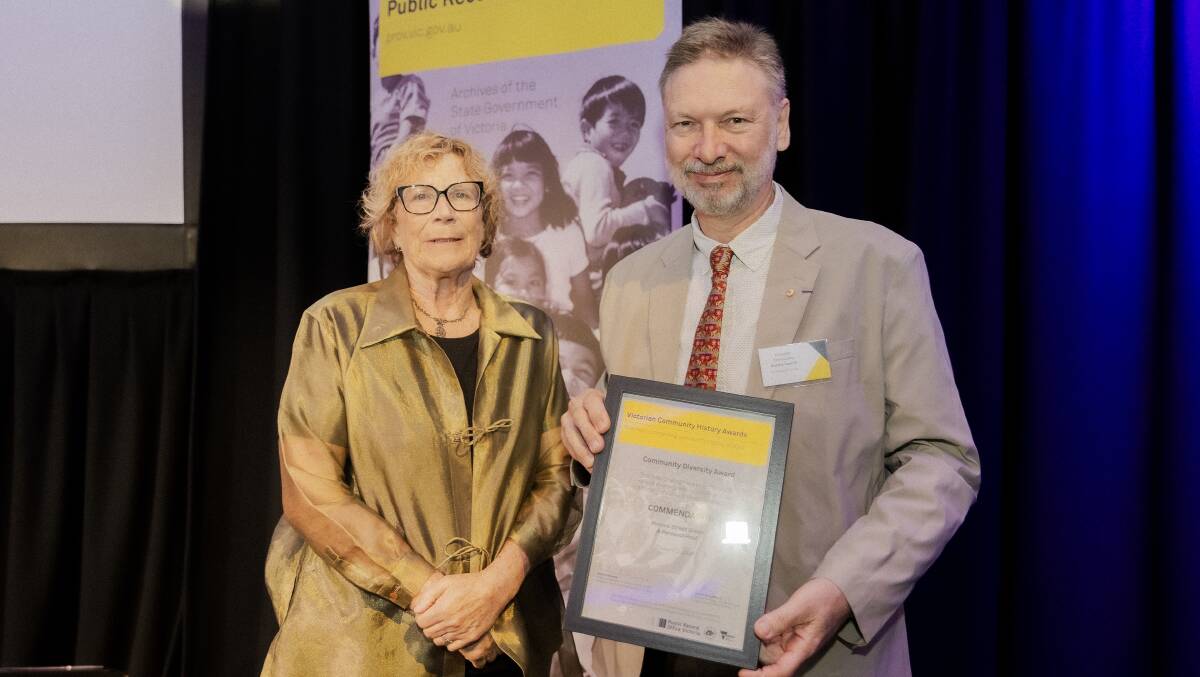Edward Duyker receives his award from Judy Maddigan. Picture supplied