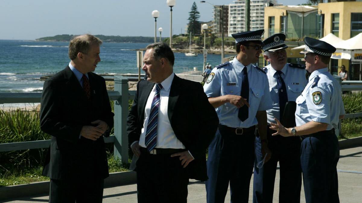 Carl Scully, Morris Iemma and senior police including Mark Goodwin at North Cronulla in the week before the riot, after concerns were raised of a vigilante response following an assault on lifesavers. Picture: Andrew Meares