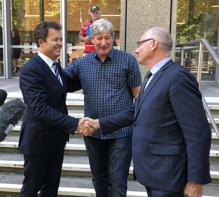 Congratulations: Maitland Christian Church pastor Bob Cotton congratulates Attorney-General Mark Speakman after the new penalties were announced. An emotional Hunter survivor Paul Gray (centre) strongly campaigned for the changes.