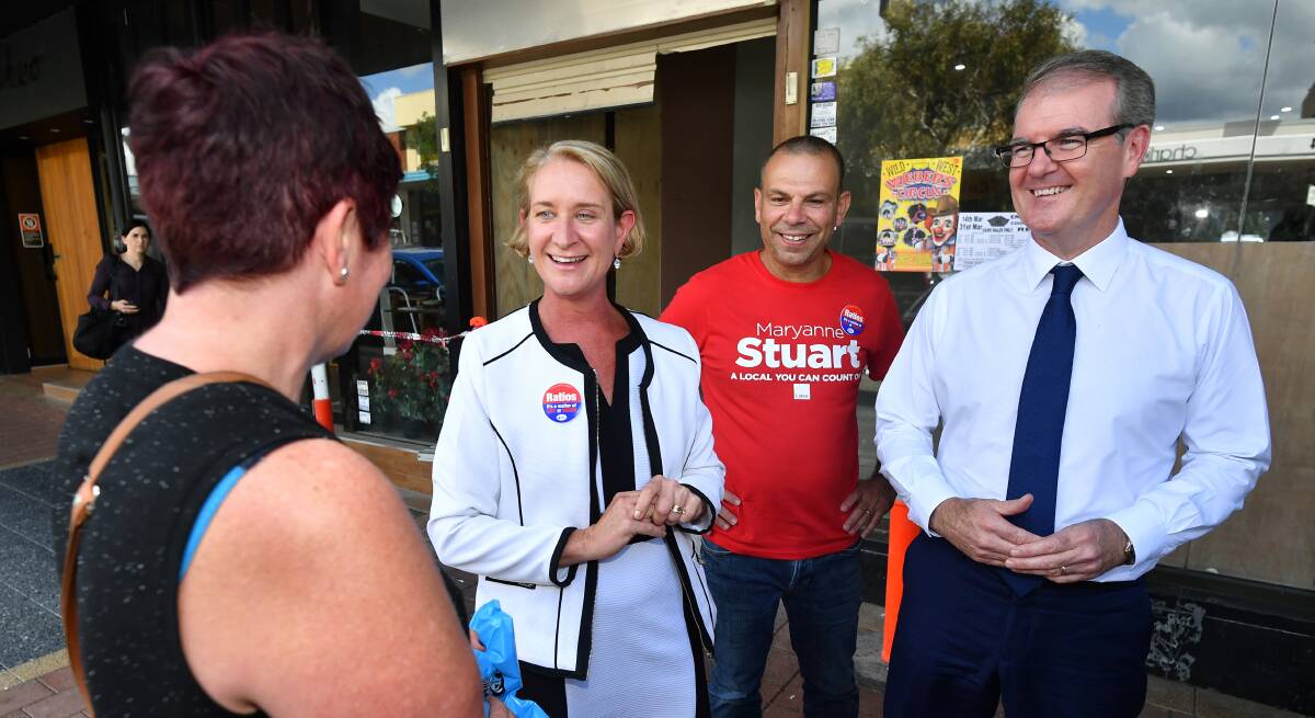Mark Buttigieg (red t-shirt) campaigning in Engadine for a NSW Upper House seat with Labor candidate for Heathcote, Maryanne Stuart and former NSW Leader of the Opposition Michael Daley. Picture: AAP 