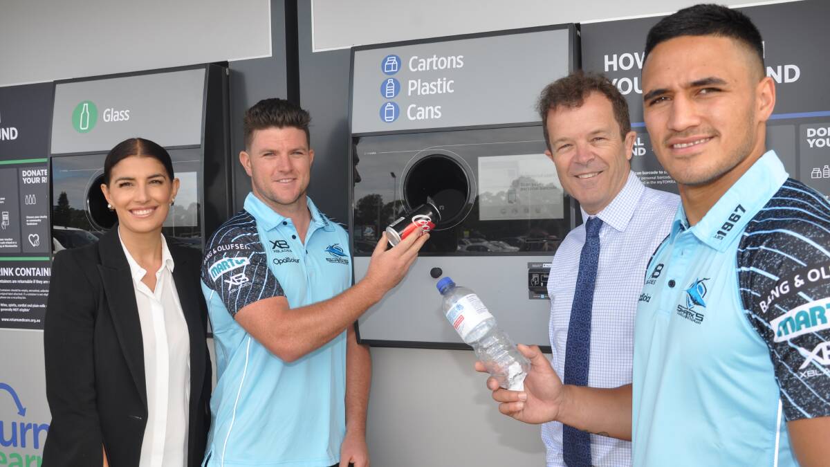 Up and running: Eleni Petinos, Chad Townsend, Mark Speakman and Valentine Holmes try out the reverse vending machine at Shark Park. 