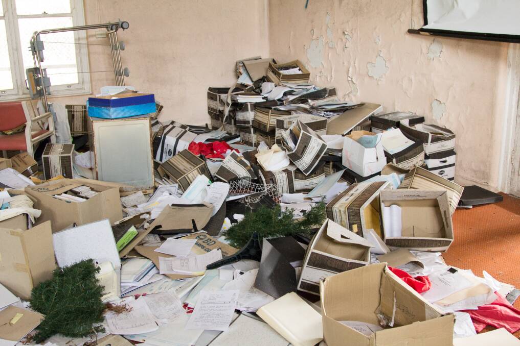More than 1000 confidential medical records were left on the floor of a derelict building which was previously part of the Garrawarra Centre at Waterfall. Pictures: triple j Hack, ABC News 
