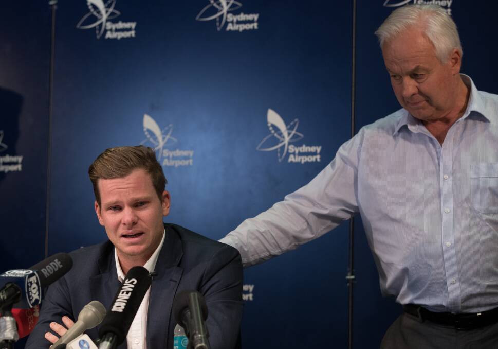 "I'm sorry": An anguished Steve Smith, supported by his father Peter, addresses the media at Sydney Airport on his arrival back from South Africa. Picture: Janie Barrett