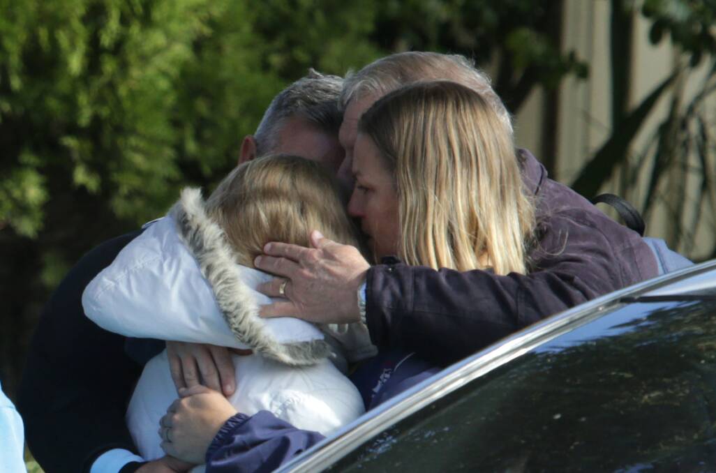 Jacinta Laverance, 11, is reunited with her family after being found safe and well shortly before 1pm near A R Hurst Reserve in Sylvania. Pictures: John Veage