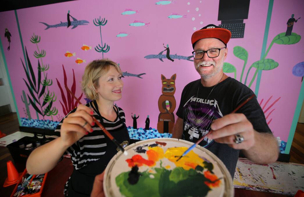 Colourful creations: Marc Etherington and his wife Kate put the finishing touches to a mural they painted at the Hazelhurst Art Gallery in 2017. Picture: John Veage