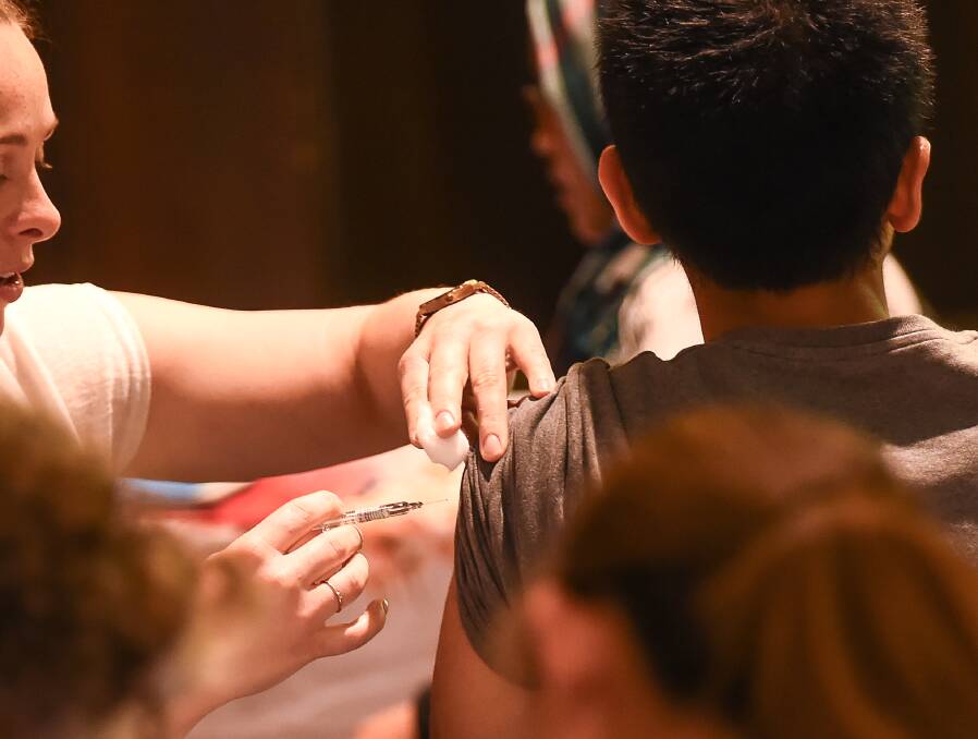 A free flu shot as part of a flu prevention event. Picture: Justin McManus