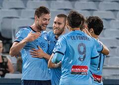 Reward: Sutherland Sharks captain Jacob Tratt (far left) celebrates his goal for the Sky Blues during the Sydney derby. Picture: Supplied
