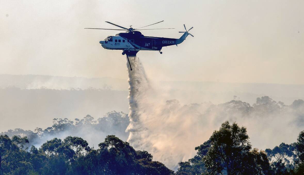 Fire brigades from Sutherland Shire battle the fire.