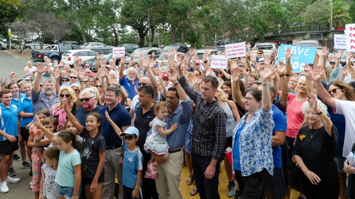 Show of hands: About 250 people attended a recent rally to voice support to save Carss Park Pool.
