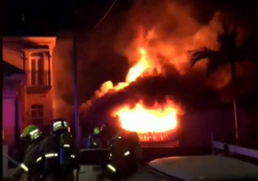 The home in Carrington Street, Bexley, was well alight when firefighters arrived on the scene. No one was home at the time. Picture: 9News