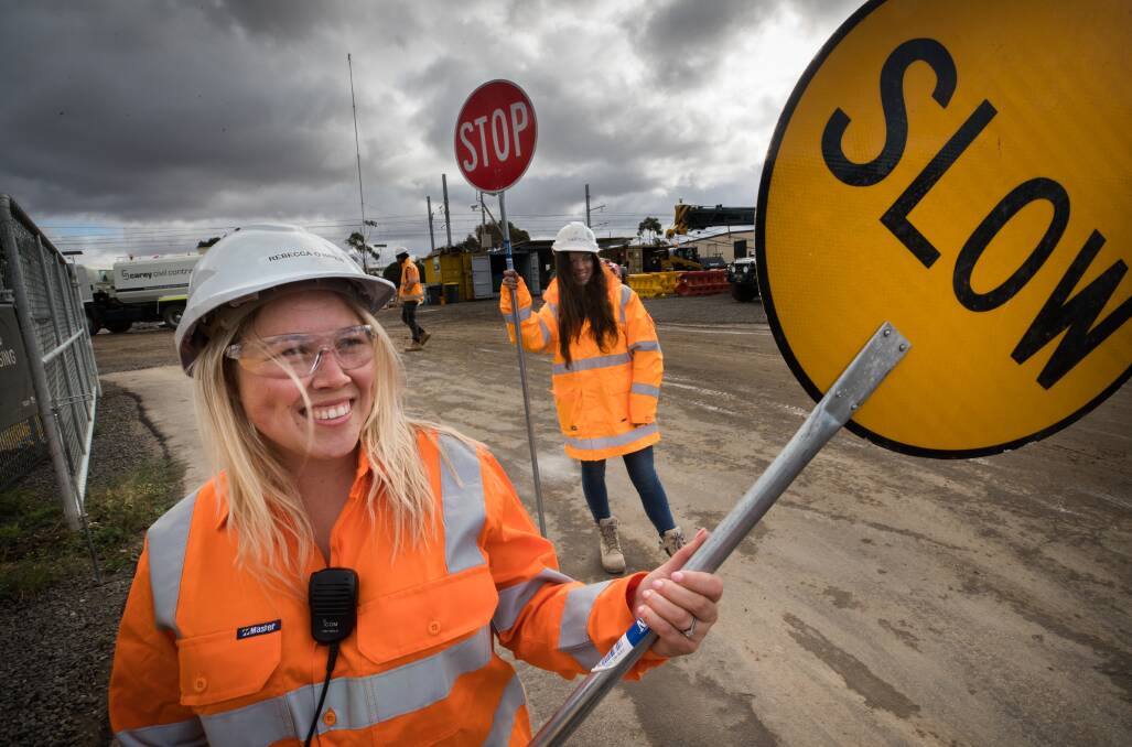 Calming infludence: Rebecca Longo and Sherydan Fitzgerald work as traffic controllers. Picture: Jason South