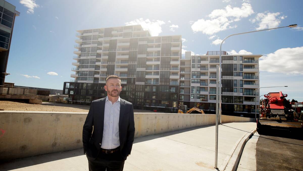 Court short: John Flinn at the Ramsgate Park development where he found the courtyards of his three new units were "signficantly shorter" than promised. 
