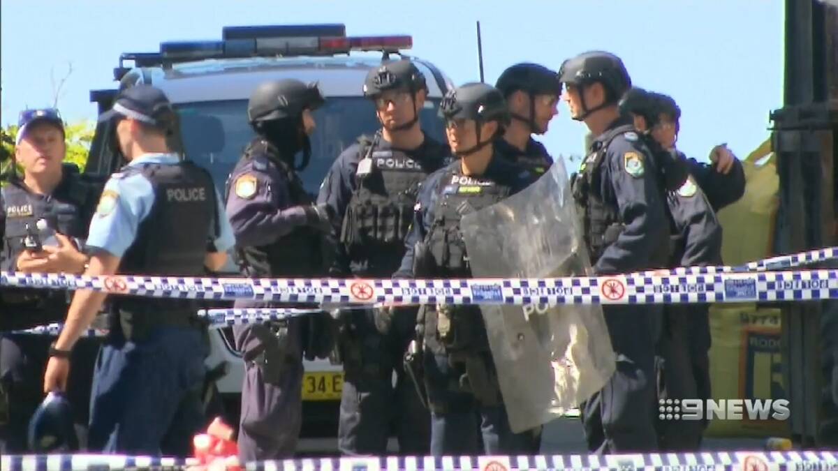 A man remains on the run after an alleged stabbing at a construction site in St Peters. Picture: 9News