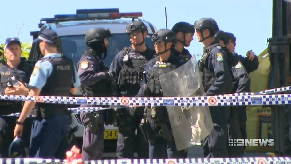 A man remains on the run after an alleged stabbing at a construction site in St Peters. Picture: 9News