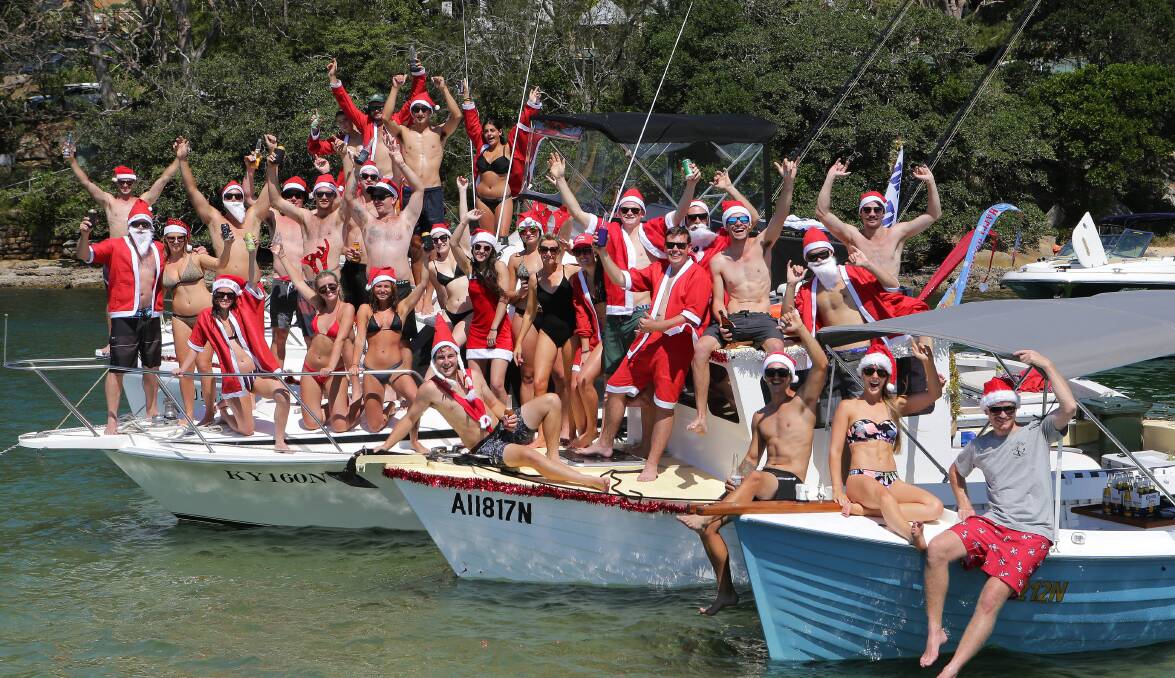 Ho, ho, ho: The festive spirit was alive and well during the Carols by Cruiser on the Port Hacking River on Saturday. Picture: John Veage