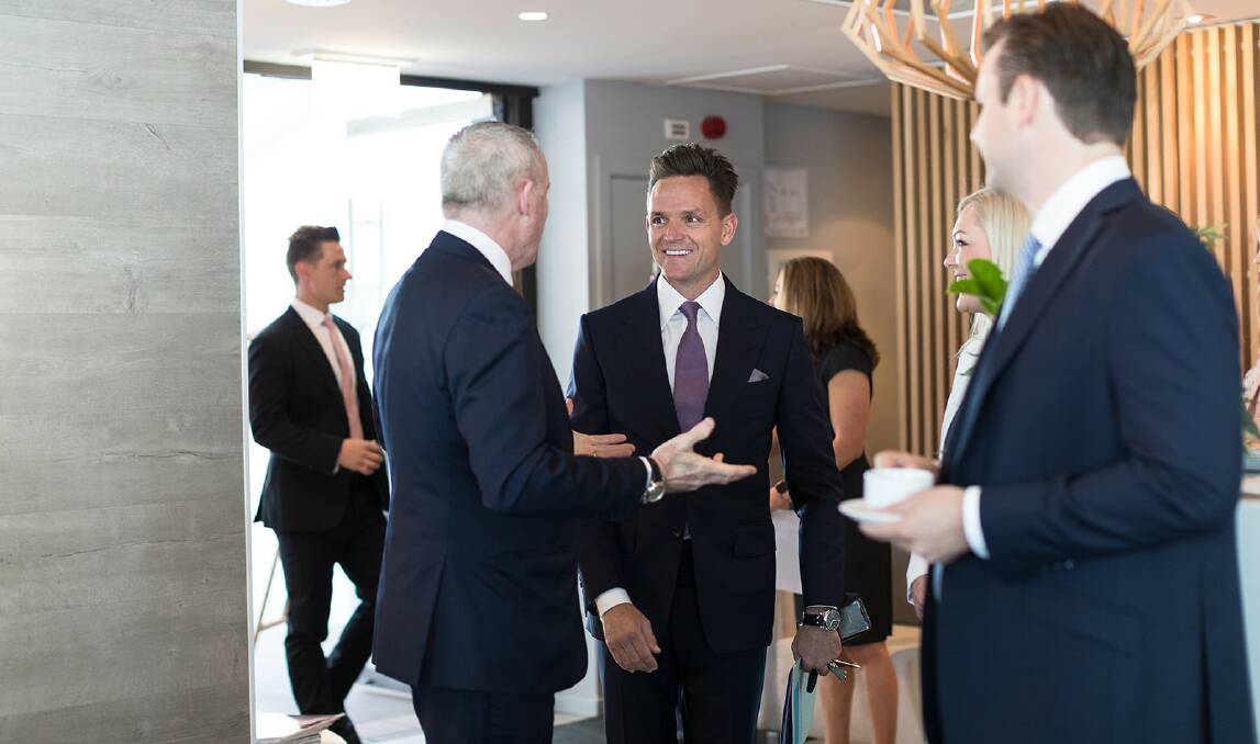 Managing Director, Highland Property Group, David Highland (centre) welcomes guests at the Property Summit held at Summersalt yesterday. Picture: Dominic Kieler