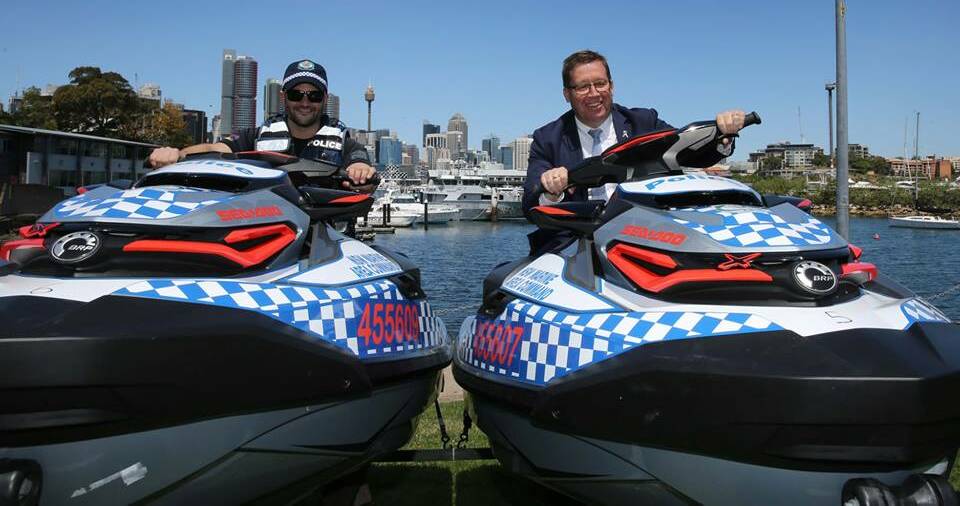 Minister for Police Troy Grant (right) on one of the 14 new jet skis to be used by the Marine Enforcement Team. Picture: NSW Police