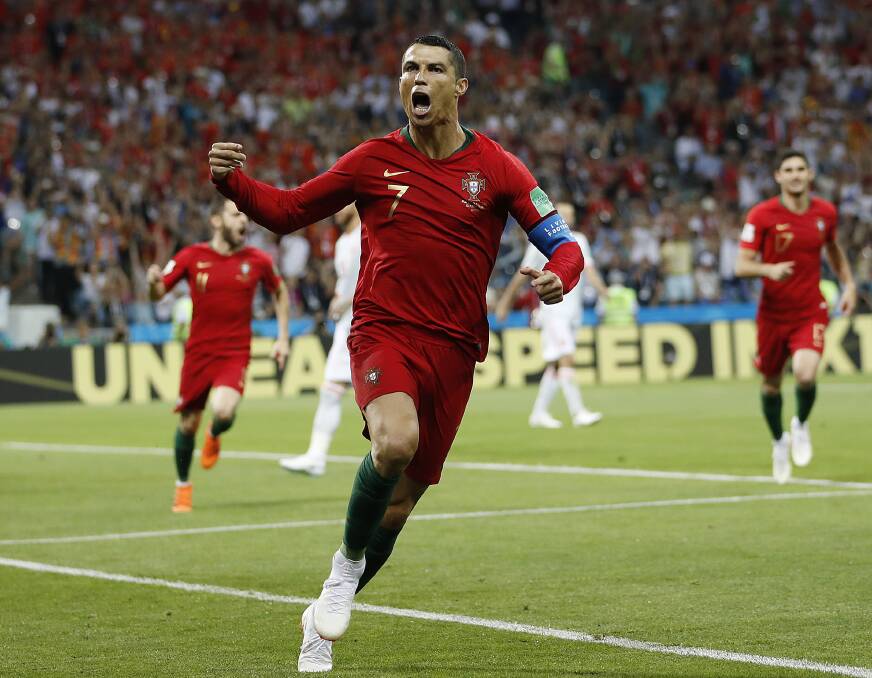 Cristiano Ronaldo celebrates a goal against Spain at the 2018 football World Cup in Russia. The game was broadcast by SBS which has now been allowed to broadcast all remaining group stage games of the tournament because of the technical issues facing rights holder Optus. Picture: AP