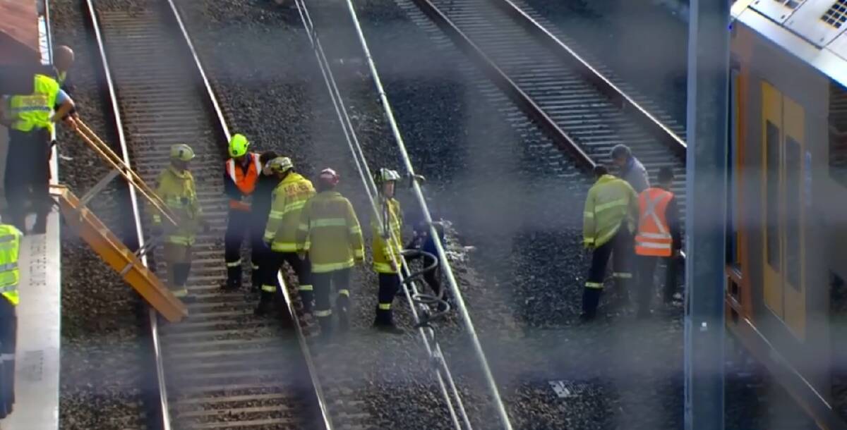 A man has been fatally struck by a train at Riverwood. Witnesses say the young man was seen spraying graffiti on a stationary train when he stepped back into the path of an oncoming express train. Pictures: 9News