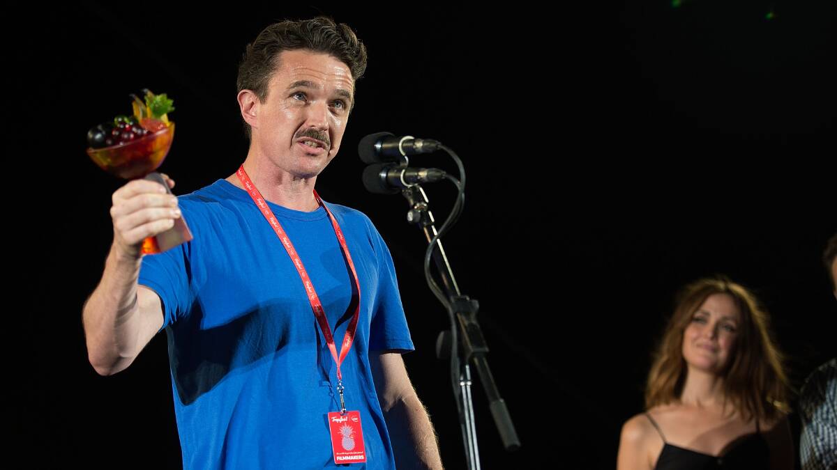 Dark comedy: The winner of Tropfest 2017 Matt Day salutes the crowd at Parramatta Park.