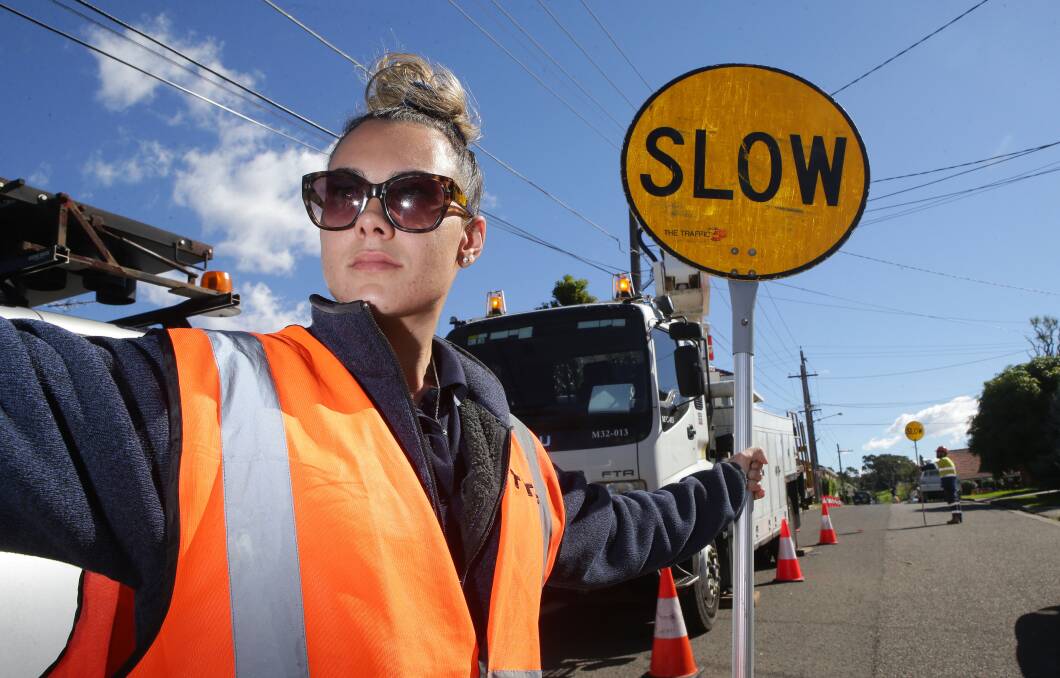 Traffic management: Brianna Higgins from Brighton-Le-Sands at work on a Kogarah construction site. Picture: John Veage