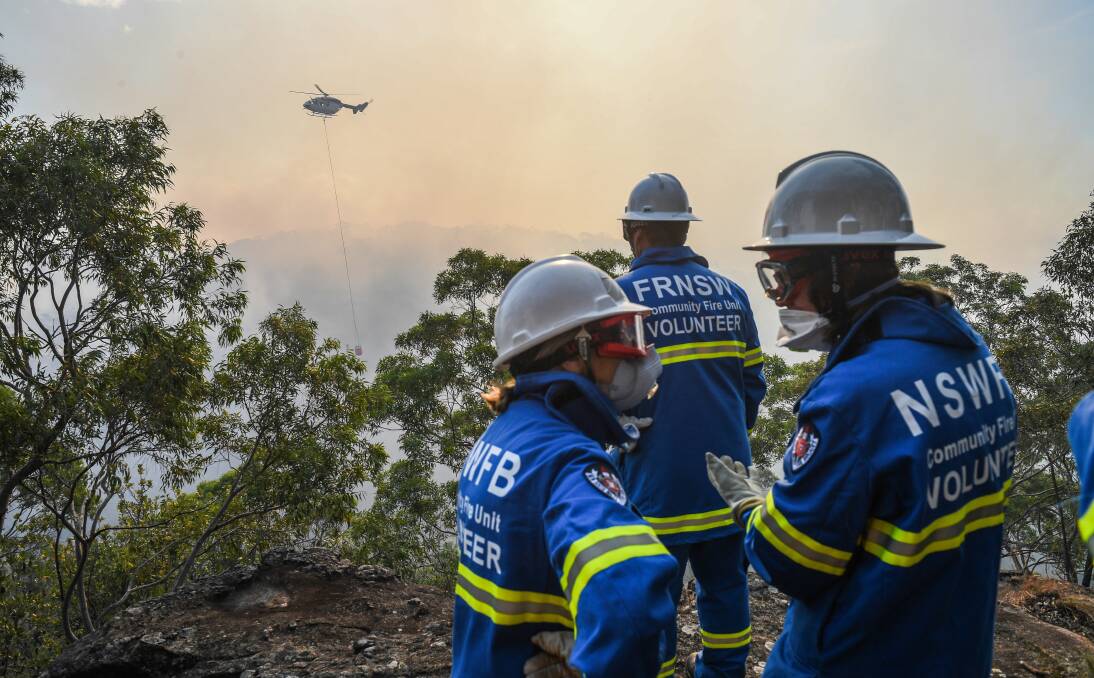 Strong winds pushed the flames north and east towards suburban streets all afternoon as 15 firefighting and reconnaissance aircraft joined the operation. Picture: AAP