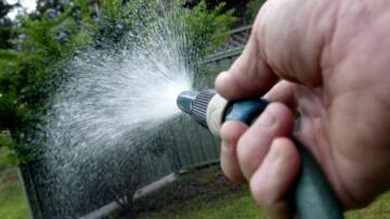 Tougher rules: Watering gardens with a hose will be banned from December 10 when Level 2 restrictions start. Picture: Adam McLean