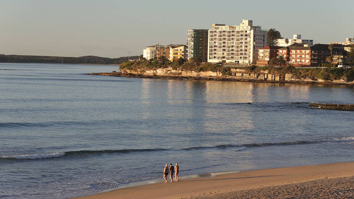Early morning swimmers at Cronulla take advantage of the mild winter conditions. Picture: John Veage