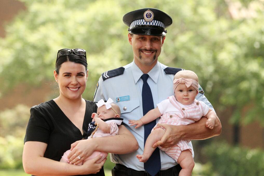 First aid: Constable Caitlin McNaughton, with 11-week-old Lily, and Senior Constable Daniel Fordyce, with eight-month-old daughter Alaska, received the Police Area Commander's Certificate of Commendation for bravery and courage displayed at a house fire in Gymea. Picture: Chris Lane 