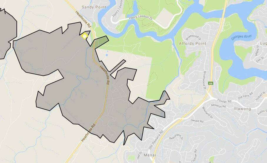 The out of control fire has burnt more than 1,000 hecatres of bushland around Holsworthy and Menai (grey area). Picture: NSWRFS
