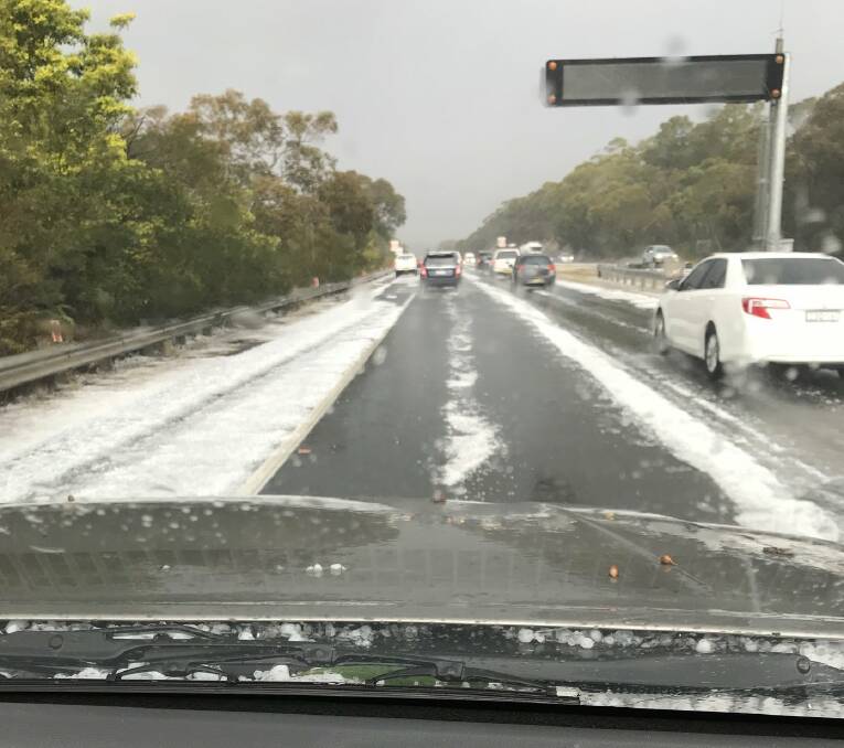 Small hail accumulates on the Princes Highway near Waterfall. Picture: NSW SES