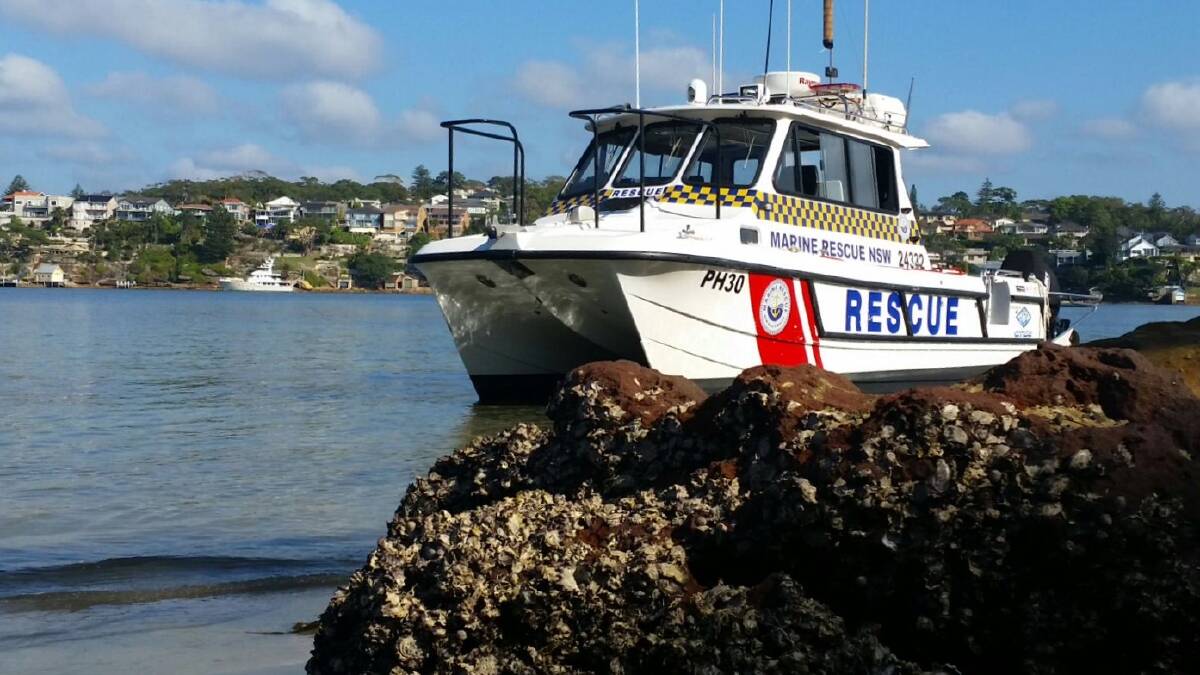 The search and rescue vessel Port Hacking 30 stranded on sand at Darook Park Sunday, 