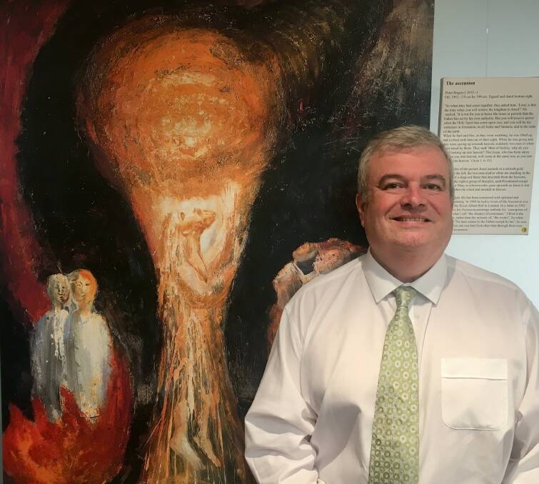 Graham Boyd, CEO Beauty Point Retirement Resort, with one of the artworks in the exhibition.