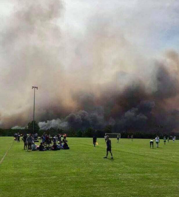 Spectators and players at a football game at Barden Ridge this morning. Picture: Facebook