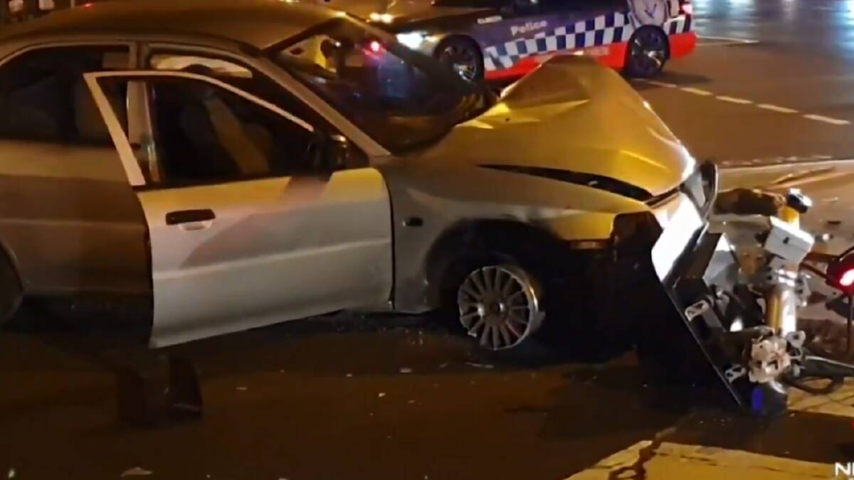 An 18-year-old male driver and his 17-year-old female passenger were arrested and taken into custody when the stolen car they were driving crashed into a traffic light at Taren Point following a police pursuit. Pictures: 7News