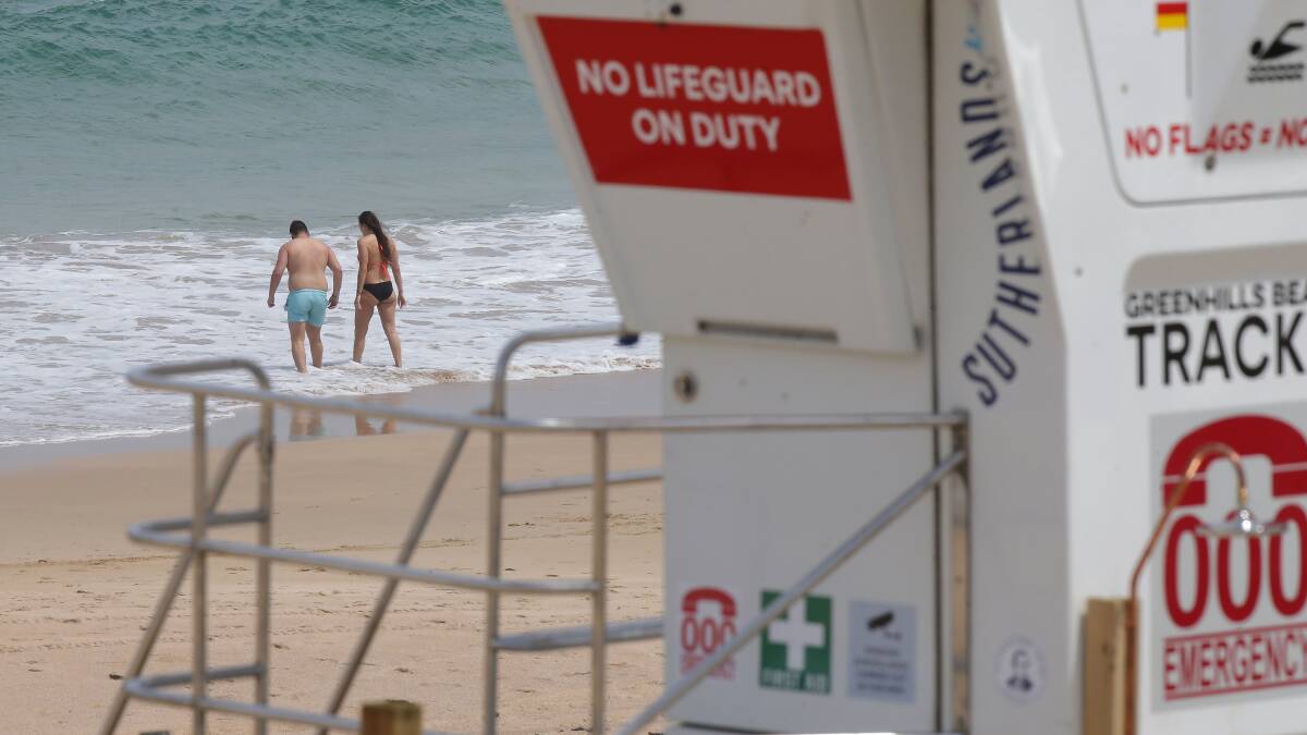 Dilemma: The temporary lifeguard tower at Greenhills beach provides greater safety but the council says people should not swim there. Picture: John Veage
