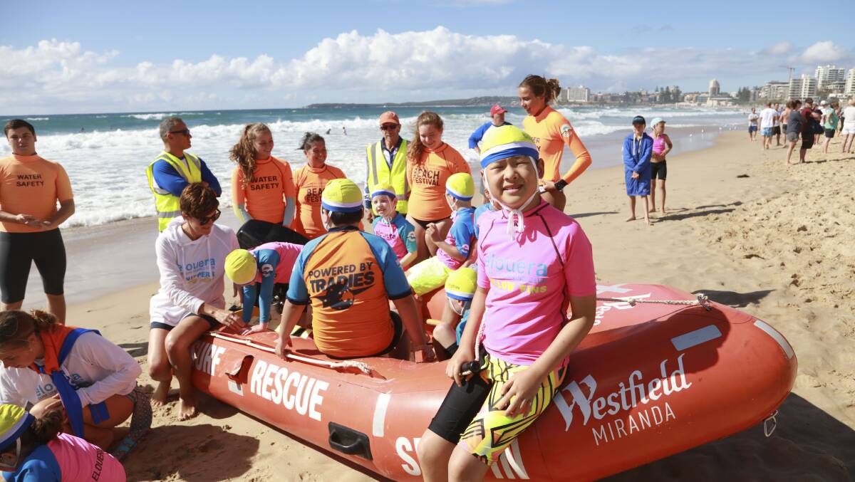 Elouera Surf Life Saving Club teams up with Autism Spectrum Australia to give children the opportunity to practice their beach skills. Picture: Rising Sun Photography