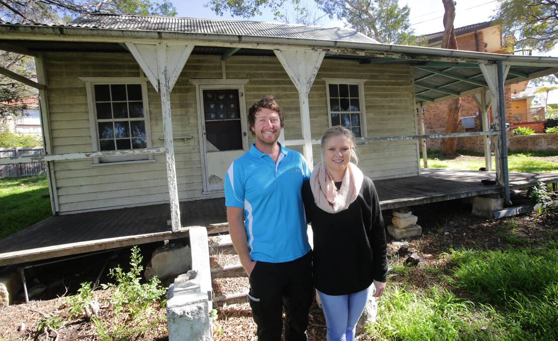 Community praise: Daniel Simpson and Brittany Dutton outline their plans for Gunyah cottage, which is believed to be the shire's oldest building. Picture: John Veage
